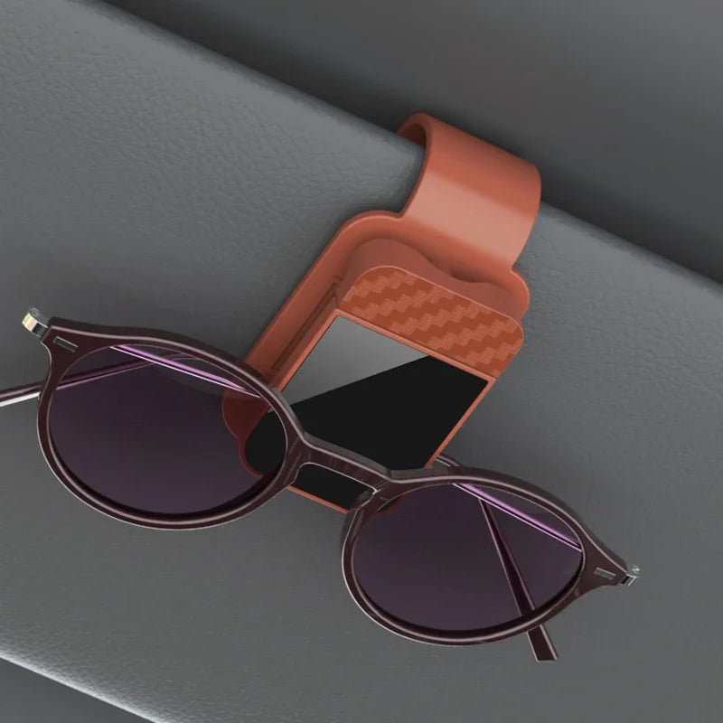 The Visor Clip That Keeps Your Sunglasses From Sliding Under the Seat