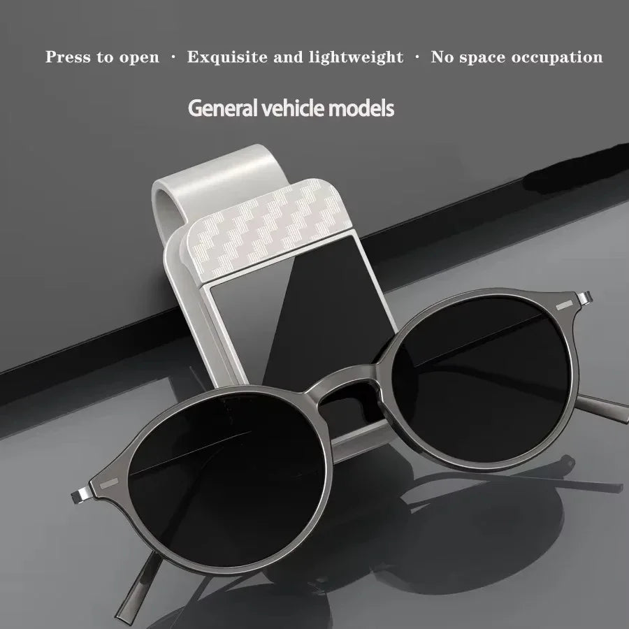 The Visor Clip That Keeps Your Sunglasses From Sliding Under the Seat