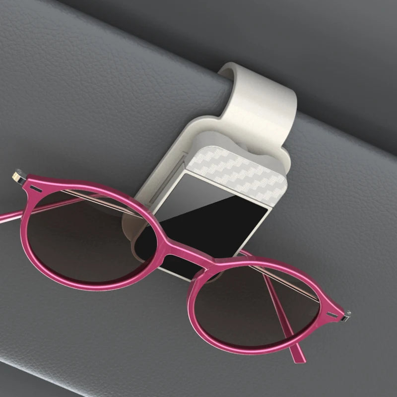 The Visor Clip That Keeps Your Sunglasses From Sliding Under the Seat