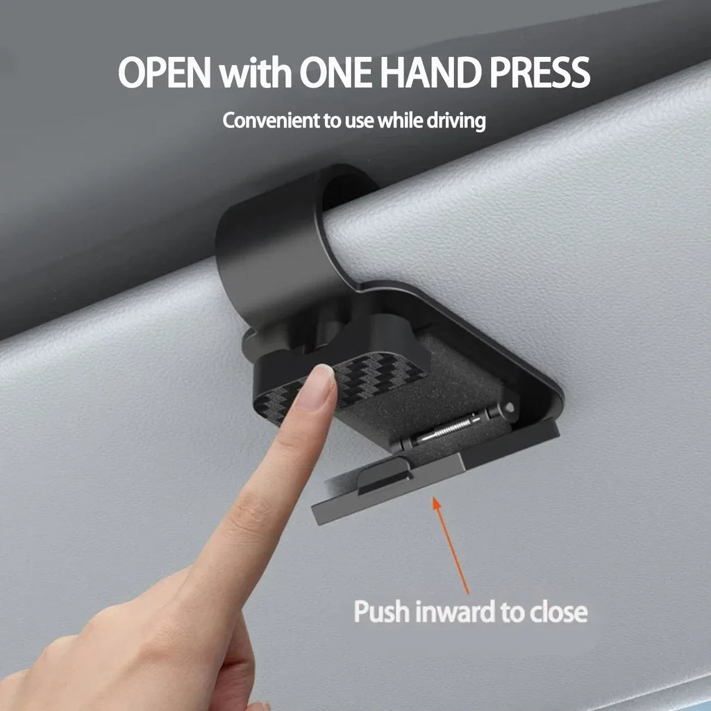 The Visor Clip That Keeps Your Sunglasses From Sliding Under the Seat