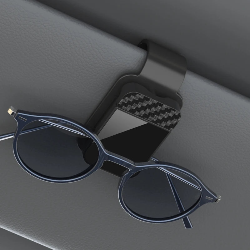 The Visor Clip That Keeps Your Sunglasses From Sliding Under the Seat
